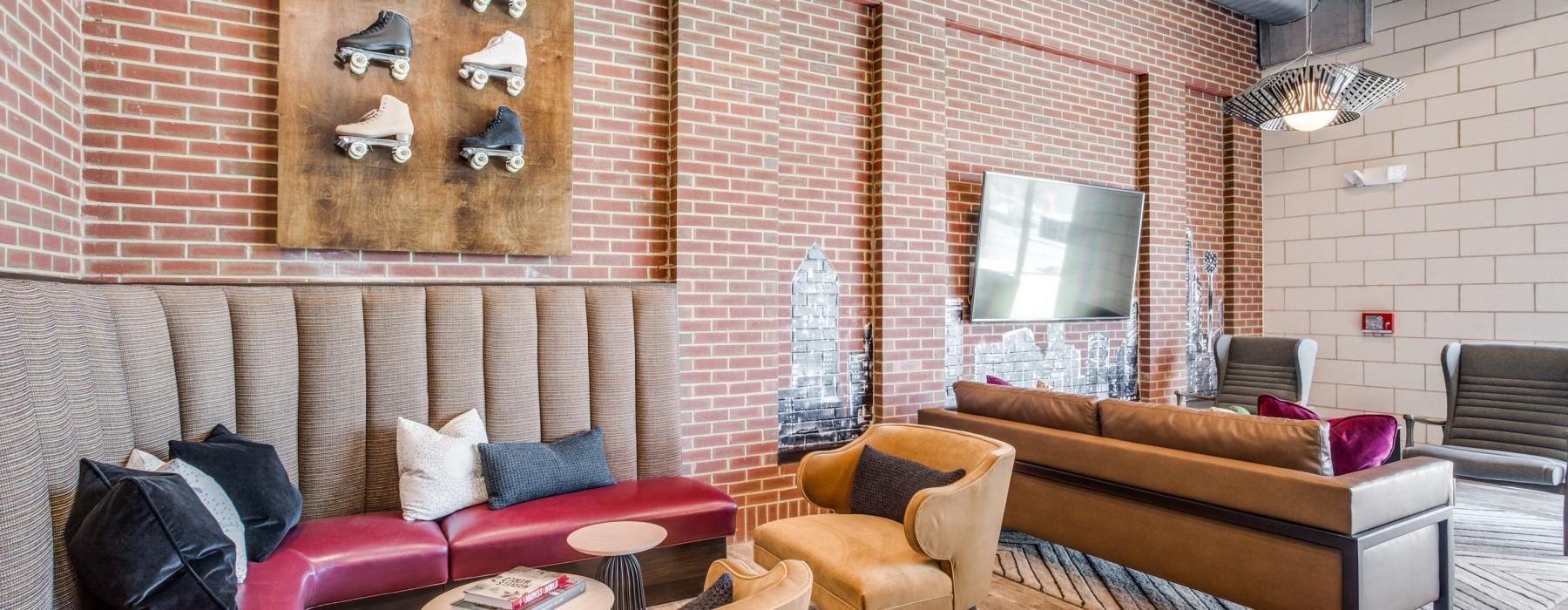 a living room with a brick wall