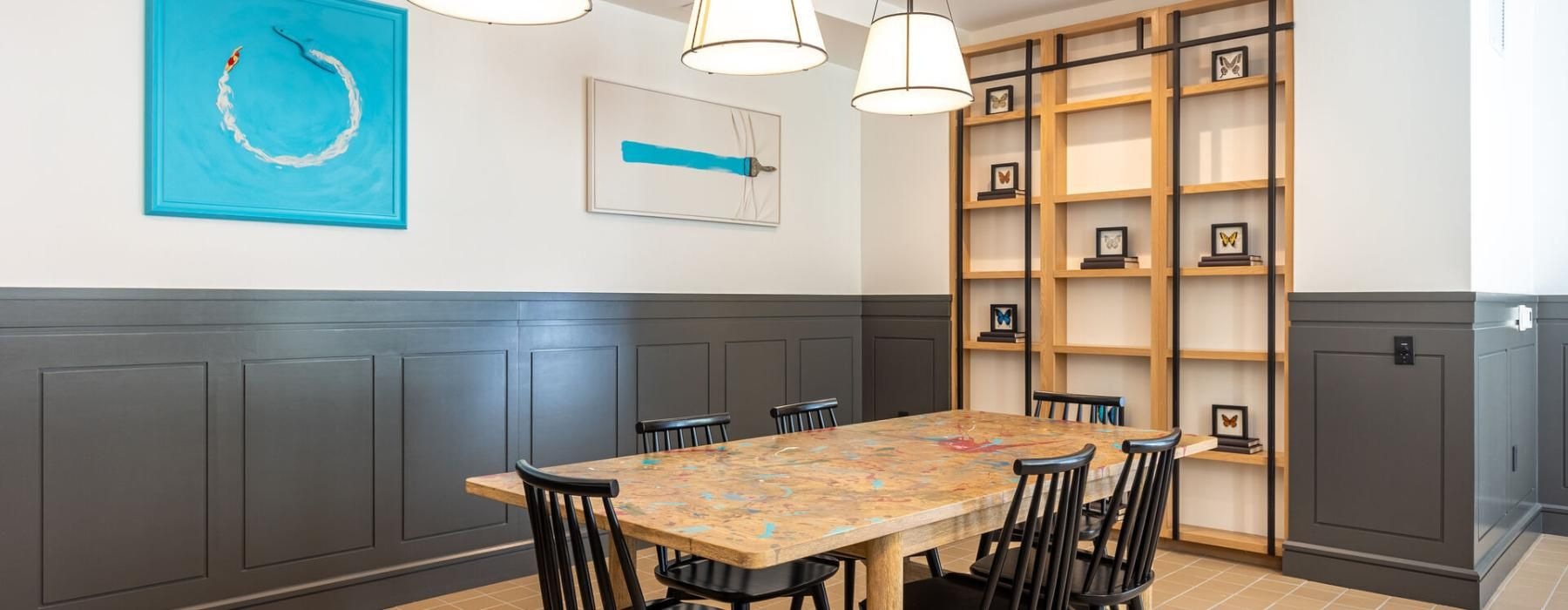 a dining room with a table and chairs