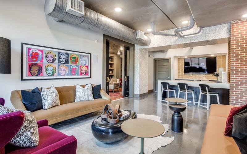 a living room with a couch and a table