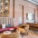 a living room with a brick wall